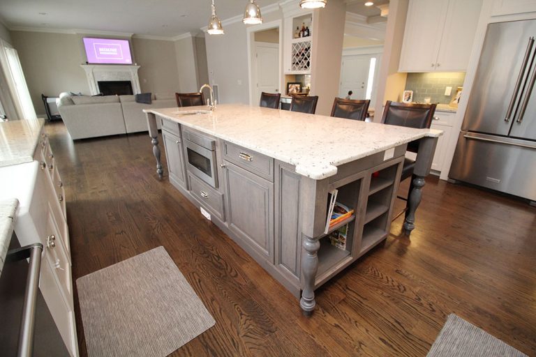 Whitewashed-Kitchen-Island-with-Intricate-Corner-Countertop-Cuts